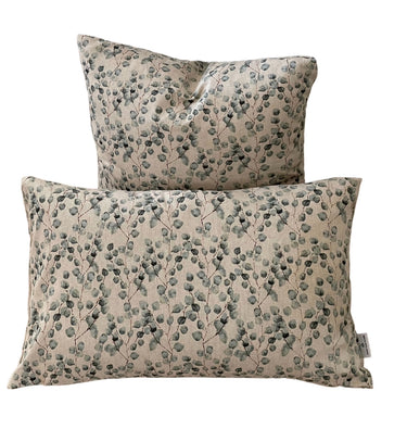 Handmade natural cushion with green leaf design